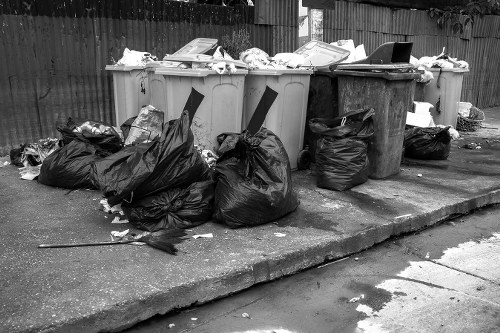 Construction site with various waste materials being cleared